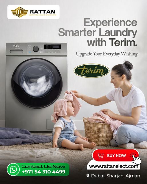 Mother folding laundry with baby beside a front-loading washing machine in a home setting